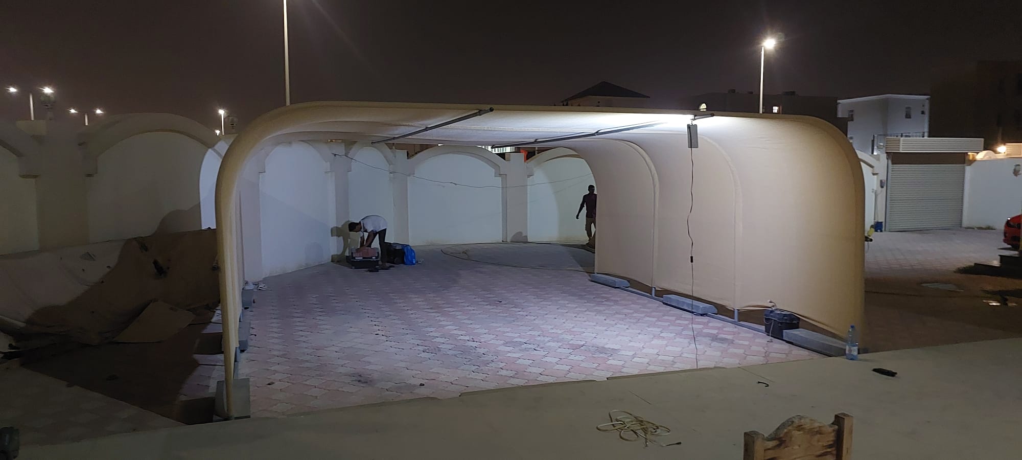 Spacious open carport structure with arched design